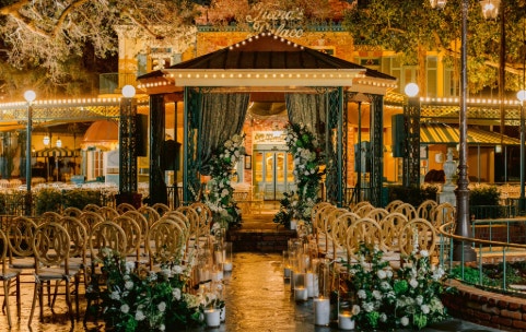 A wedding ceremony setup in front of Tiana's Palace restaurant in Disneyland Park