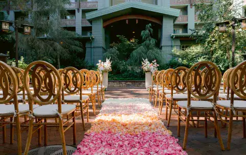 A wedding ceremony aisle covered in rose petals at Disney's Grand Californian Hotel and Spa
