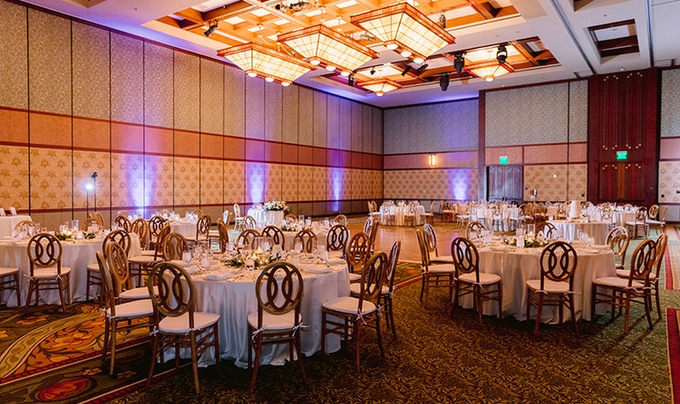 A hotel ballroom with tables and chairs at Disney's Grand Californian Hotel & Spa