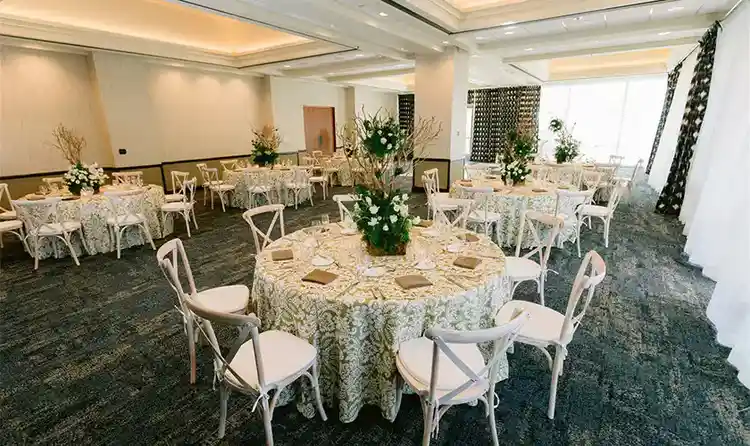 Reception room with tables and floral centerpieces