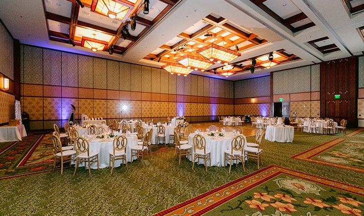 A hotel ballroom with tables and chairs at Disney's Grand Californian Hotel & Spa