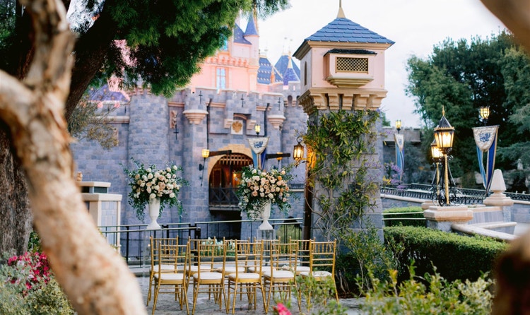 Full view of The Fantasy Faire Garden in Disneyland next to Sleeping Beauty Castle