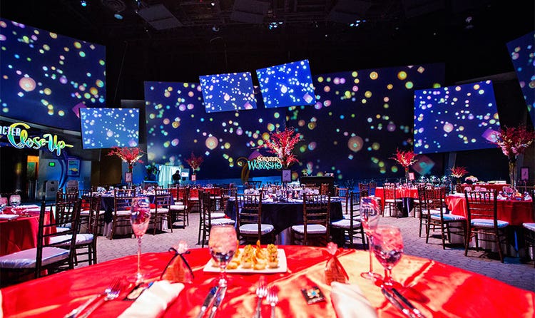 An event room with projection panels featuring artwork of the floating lanterns from Tangled