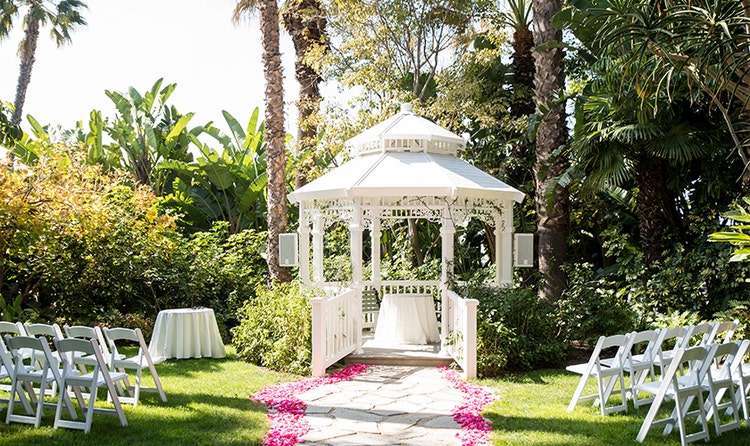 Two sets of chairs on either side of a gazebo