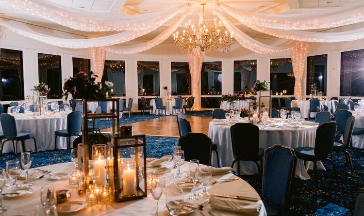 An elegantly decorated event room around a dance floor at the Disneyland Hotel