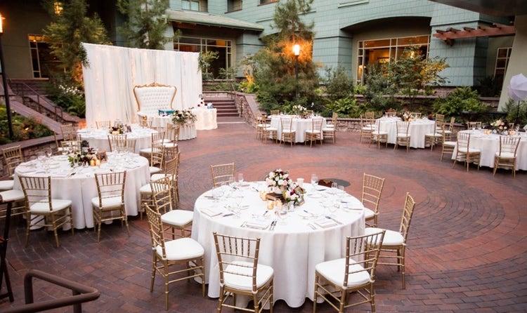Tables and chairs set up in a courtyard at Disney’s Grand Californian Hotel and Spa