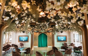 Flowers and leaves suspended over the seating area of The Bayou lounge