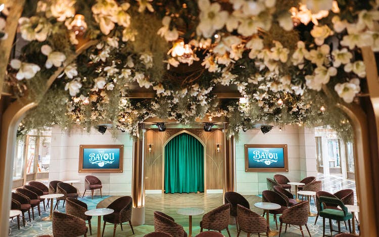 Flowers and leaves suspended over the seating area of The Bayou lounge