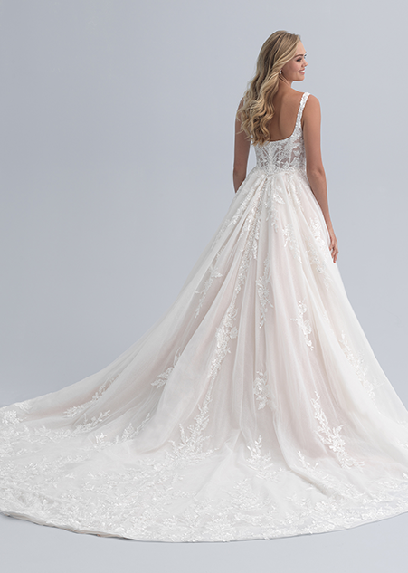 The back of a wedding dress with a fitted bodice and a full skirt both adorned with flowers
