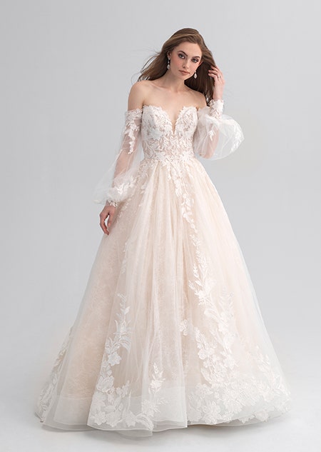 A woman wearing a lacy and strapless wedding dress
