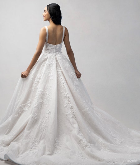 The back of a bride wearing a Snow White inspired ball gown featuring lace detail and a train