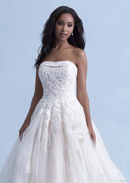 A woman in the Belle wedding gown from the 2021 Disney Fairy Tale Weddings Collection