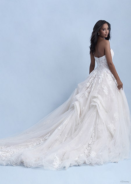A back side view of a woman wearing the Belle wedding gown from the 2021 Disney Fairy Tale Weddings Collection