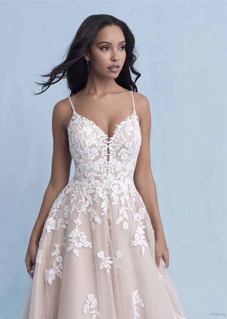 A woman in the Snow White wedding gown from the 2021 Disney Fairy Tale Weddings Collection