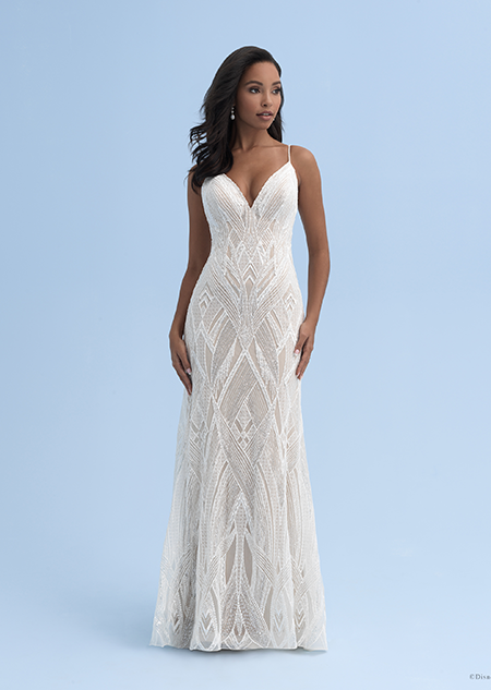 A woman wearing a wedding dress with a sweetheart neckline and skinny straps