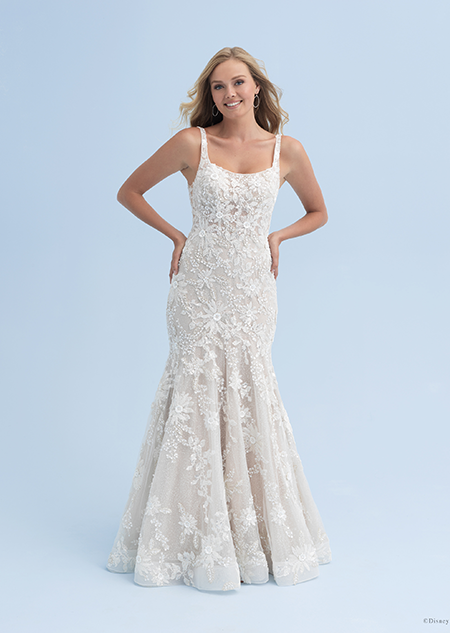 A bride in a wedding dress with a square neckline adorned with crystal flowers