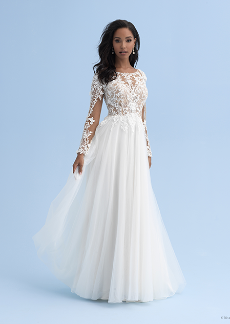 A woman wearing a wedding dress with a boat neckline and long sleeves