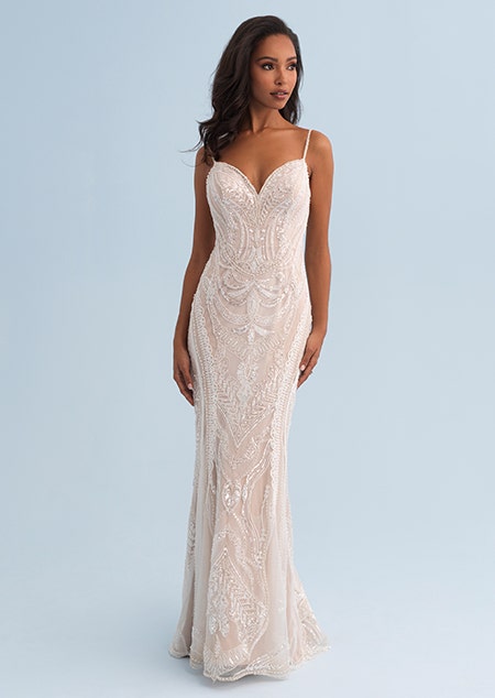A woman wearing a beaded and form fitting wedding dress
