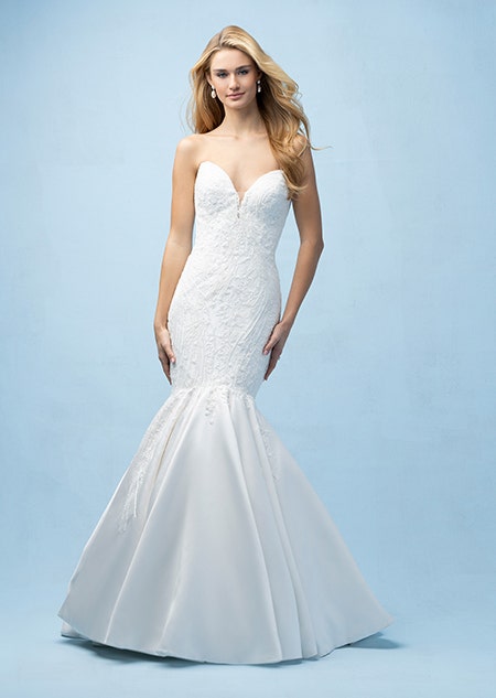 The front of a bride wearing an Ariel inspired mermaid gown featuring a sweetheart neckline and beading