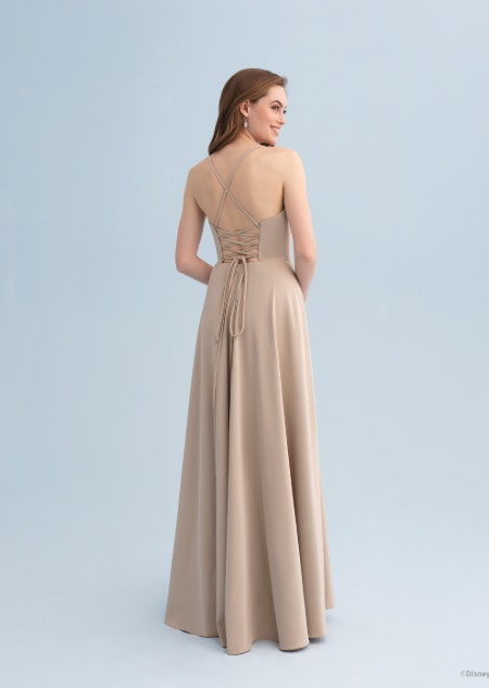 The back of a woman wearing a Belle themed bridesmaid dress with a lace up back
