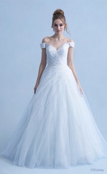 A woman wearing the Cinderella wedding gown from the 2021 Disney Fairy Tale Weddings Collection