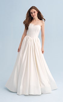 A woman wearing a strapless wedding dress with a full skirt