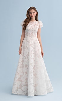 A woman wearing a wedding dress covered with a flowery pattern