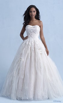 A woman wearing the Belle wedding gown from the 2021 Disney Fairy Tale Weddings Collection