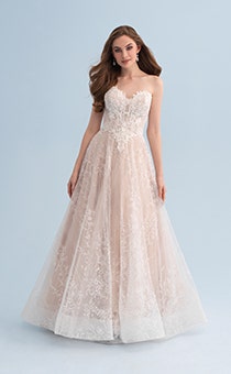 A woman wearing a strapless and lacy wedding dress