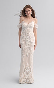 A woman wearing a form fitting wedding dress covered in a lace patter
