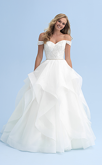 A woman in an off the shoulder dress with a skinny belted waist and a full skirt