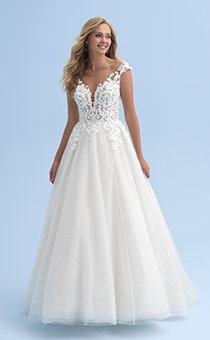 A bride wears a wedding dress with a deep neckline and straps across her shoulders