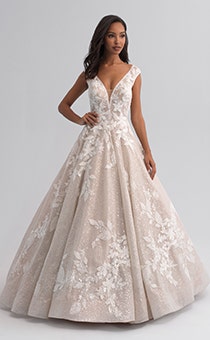 A woman wearing a sleeveless wedding gown covered with a shimmery lace
