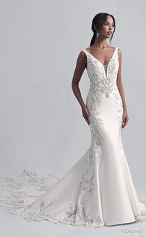 A woman in the Jasmine wedding gown from the 2021 Disney Fairy Tale Weddings Platinum Collection