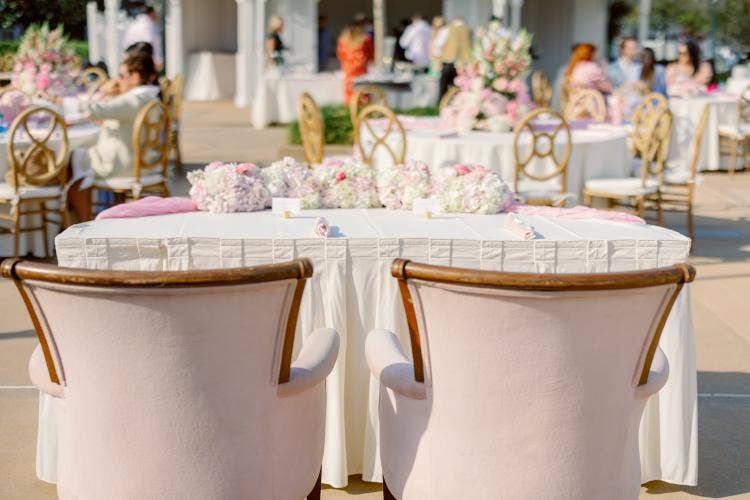 decorated wedding reception, reception, venue, venue shot, custom chairs, floral centerpieces, spring floral, pink floral, summerhouse, summerhouse patio, grand floridian