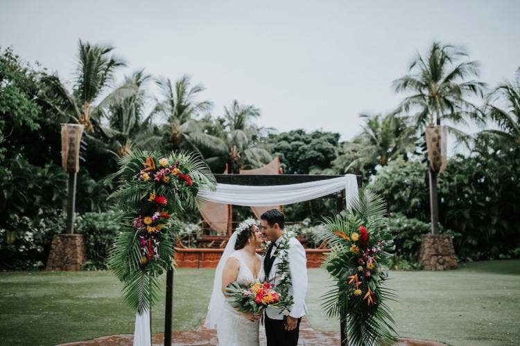 bride and groom, couple, portrait, couple portrait, wedding ceremony, ceremony, ceremony venue, ceremony decor, ceremony floral, altar area, altar decor, altar floral, tropical floral, palm fronds, aulani, aulani wedding, aulani ceremony