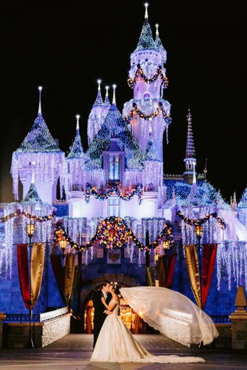 bride and groom, couple, portrait, couple portrait, Disneyland, Disneyland Park, Christmastime, sleeping beauty castle, icicle lights, castle icicle lights