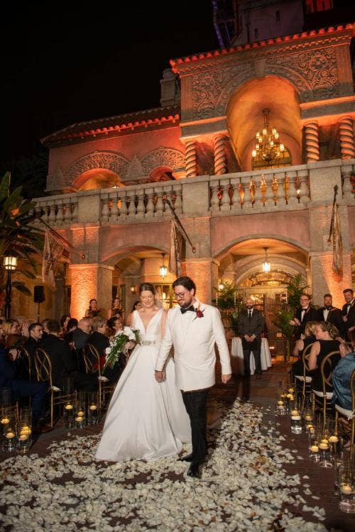 bride and groom, couple, wedding ceremony, ceremony, candid, vows, sharing vows, custom up lighting, up lighting, nighttime, tower of terror, hollywood studios, staged exit, exit