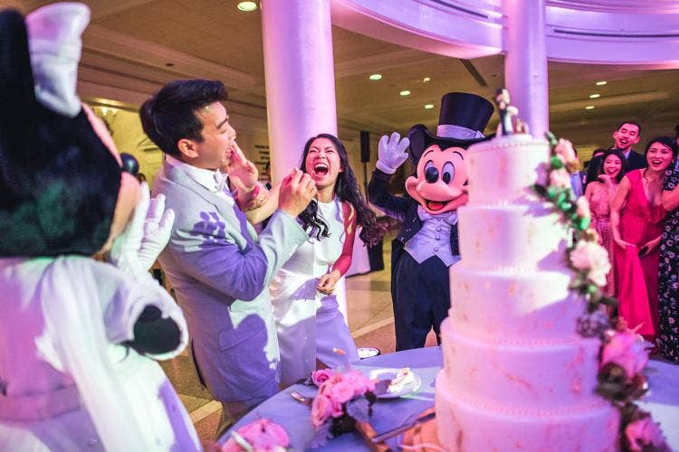 Disney Wedding, Disney Fairy Tale Wedding, cake cutting, mickey mouse, minnie mouse, wedding trends, wedding ideas