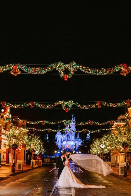 bride and groom, couple, portrait, couple portrait, Disneyland, Disneyland Park, Main Street, christmas, Christmastime, christmas tree