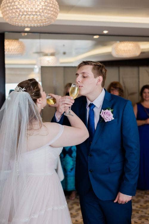 bride and groom, couple, toast, champagne toast, reception, celebration, reception celebration, cake and champagne, Disney cruise line, cruise line, cruise, overlook