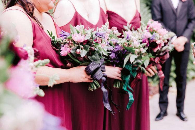 wedding ceremony, ceremony, floral, personal floral, bridesmaid bouquets, bouquets, halloween, halloween theme, moody aesthetic, purple floral, burgundy floral, nightmare before christmas