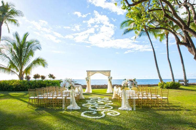 decorated wedding ceremony, wedding ceremony, ceremony, venue, aulani, lanikuhonua, custom aisle floral, aisle floral, white floral, altar decor, custom chairs