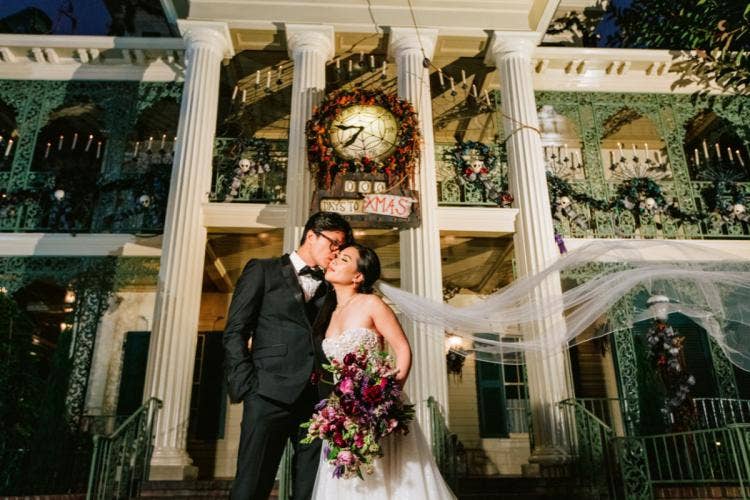 bride and groom, couple, portrait, couple portrait, disneyland, disneyland resort, haunted mansion, halloween, nighttime, moody floral