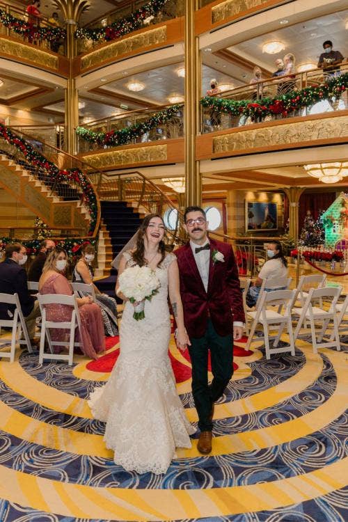 bride and groom, couple, wedding ceremony, ceremony, disney cruise line, cruise line, cruise, disney cruise, cruise wedding, atrium, christmas, christmas wedding, christmas cruise, exit, staged exit