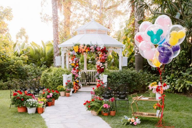 Decorated Wedding Ceremony Venue, ceremony venue, ceremony, gazebo, adventure lawn, adventure lawn gazebo, altar floral, colorful floral, aisle floral, potted flowers, custom aisle, aisle, mickey balloons