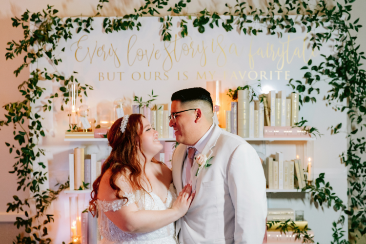 couple, portrait, wedding reception, floral wall, disneyland, sleeping beauty pavilion