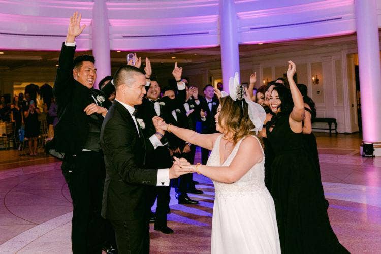 bride and groom, couple, couple with wedding guests, wedding guests, dancing, reception, wedding reception, Epcot, aa rotunda, American adventure rotunda, America pavilion
