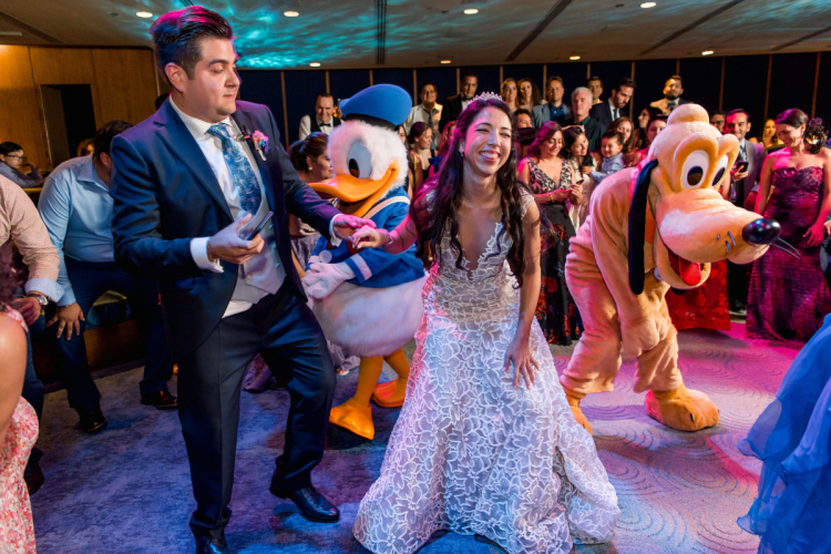 bride and groom, couple, wedding reception, reception, dancing, characters, disney characters, donald duck, pluto, living seas, living seas salon, epcot