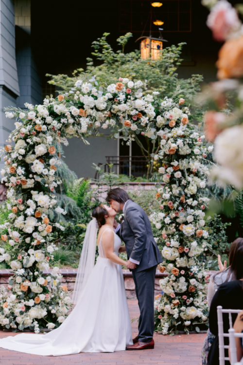 bride and groom, couple, first kiss, wedding ceremony, ceremony, ceremony altar, altar floral, altar decor, ceremony floral, ceremony decor, brisa courtyard, grand californian